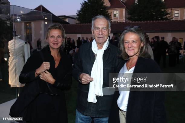 Yvon Lambert standing between his daughter Eve Lambert and Caroline Moussion attend the Kering Heritage Days opening night at Kering and Balenciaga...
