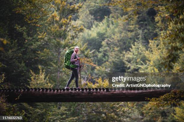 woman hiking outdoor - hiking pole stock pictures, royalty-free photos & images