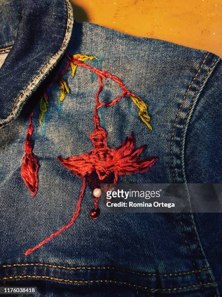 embroidery on jeans jacket - embroidery stock pictures, royalty-free photos & images