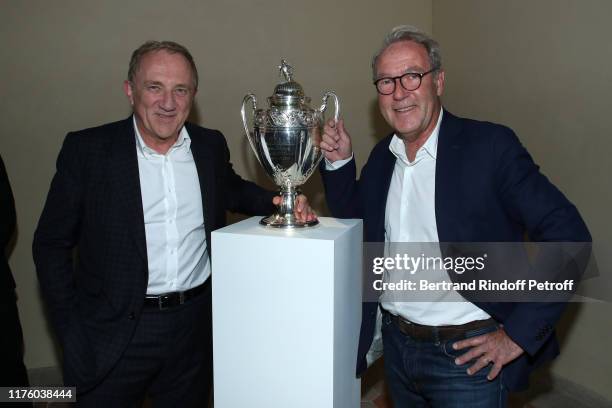 Of Kering Group, Francois-Henri Pinault and Christophe Chenut pose with the French Football Cup 2019 won by the "Stade Rennais" during the Kering...