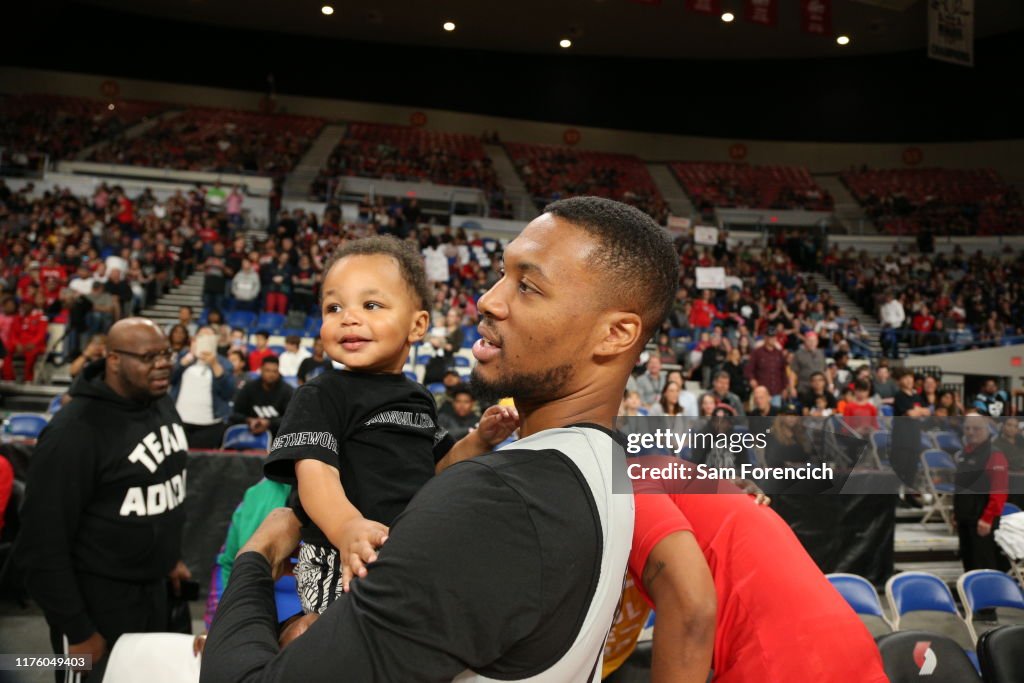 Damian Lillard of the Portland Trail Blazers holds his son during the