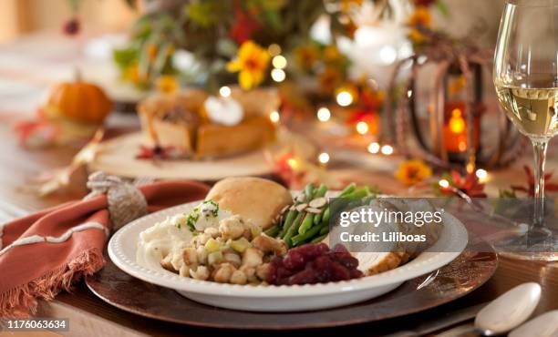 thanksgiving turkey dinner - rustic dining room stock pictures, royalty-free photos & images