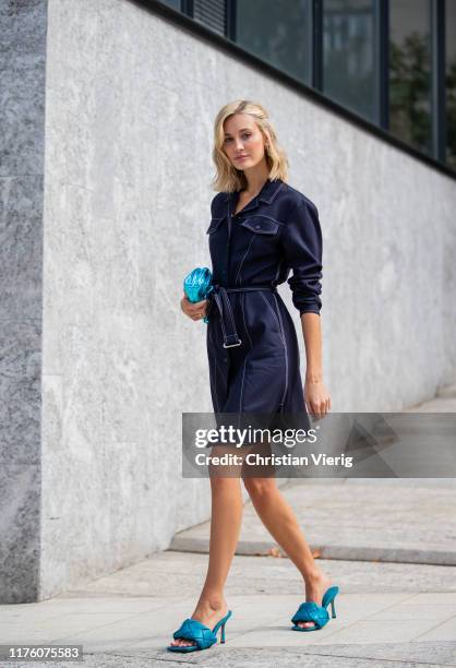Mandy Bork seen wearing metallic blue mini pouch Bottega Veneta