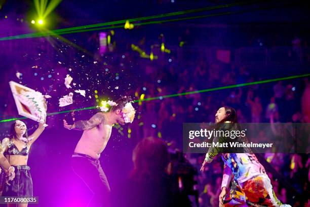 Steve Aoki throws cake on guest during the 2019 iHeartRadio Music Festival at T-Mobile Arena on September 20, 2019 in Las Vegas, Nevada.