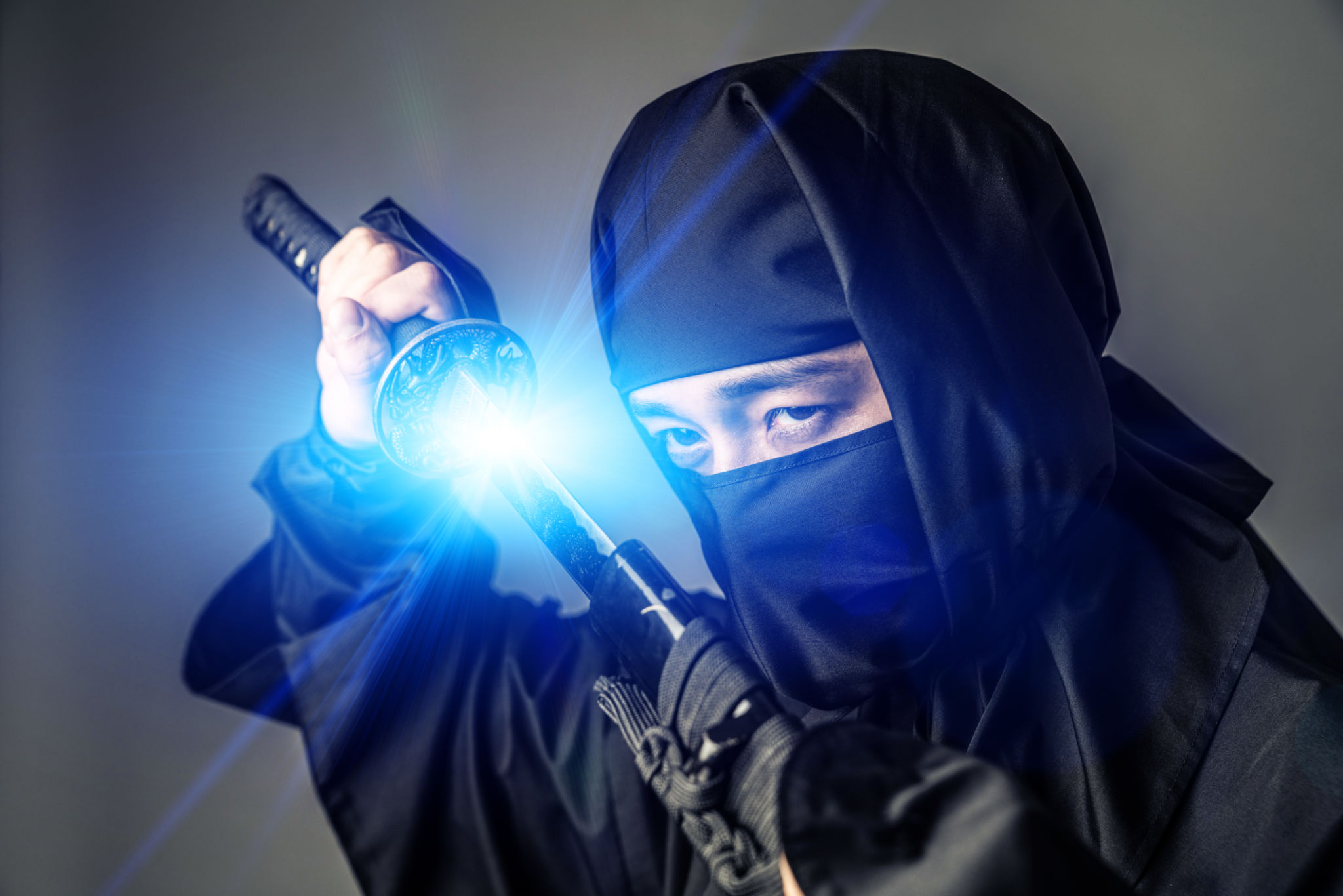 Japanese Ninja holding a katana. Samurai. Japanese Ninja holding a katana. Samurai.