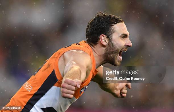 Jeremy Finlayson of the Giants celebrates kicking a goal during the AFL Preliminary Final match between the Collingwood Magpies and the Greater...