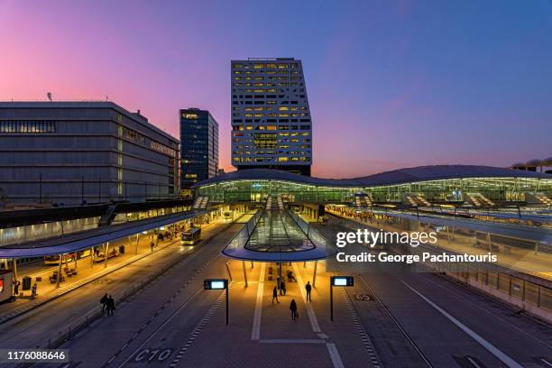 utrecht railway station at dusk - amsterdam blue sky stock-fotos und bilder