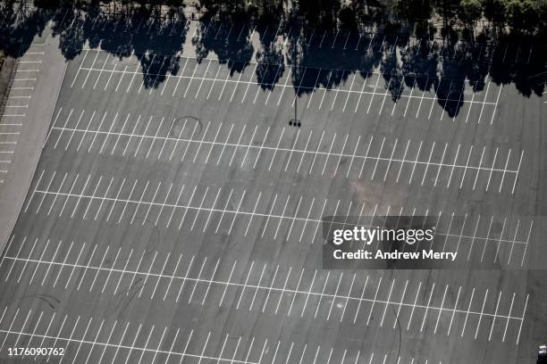 empty parking lot, car park with tree shadows aerial view - aircraft point of view stock pictures, royalty-free photos & images