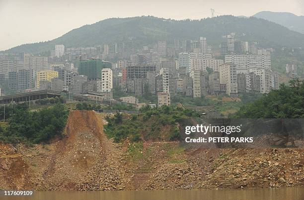 China-environment-water-Three-Gorges-dam, FEATURE by Dan MartinIn a picture taken on June 16, 2011 a landslide is seen from the water of the Yangtze...