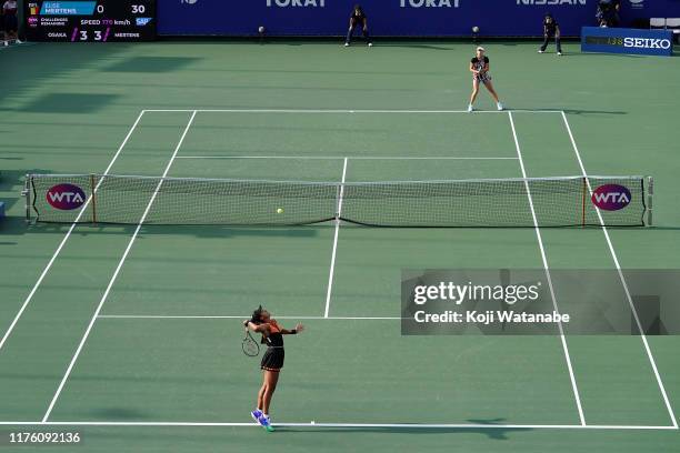 Naomi Osaka of Japan serves against Elise Mertens of Belgium during day six Semi final game of the Toray Pan Pacific Open at Utsubo Tennis Cent on...