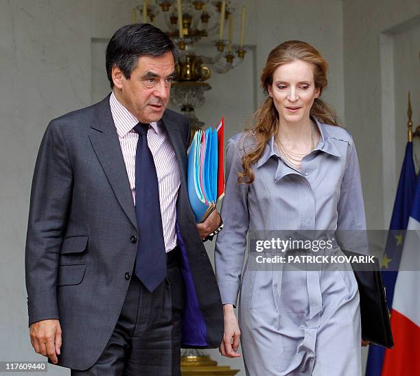 France's Prime minister Francois Fillon and Environment and Transport minister Nathalie Kosciusko-Morizet leave the Elysee presidential palace after...