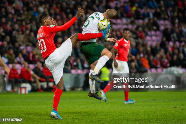 Edimilson Fernandes of Switzerland fights for the ball with Glenn Whelan of Republic of Ireland during the UEFA Euro 2020 qualifier between...