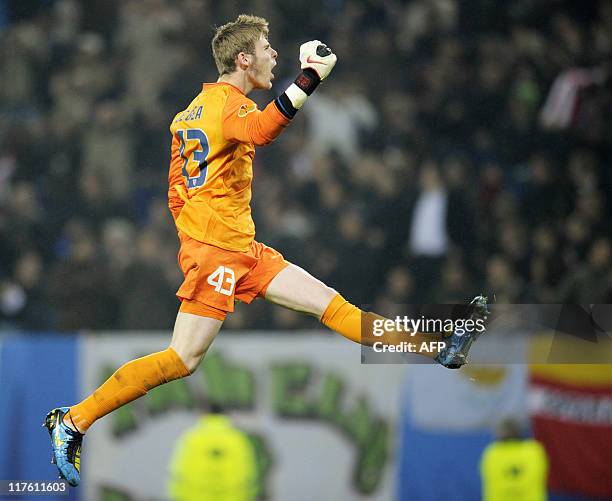This file picture taken on May 12, 2010 shows Atletico Madrid's goalkeeper David de Gea celebrating a goal during the final football match of the...