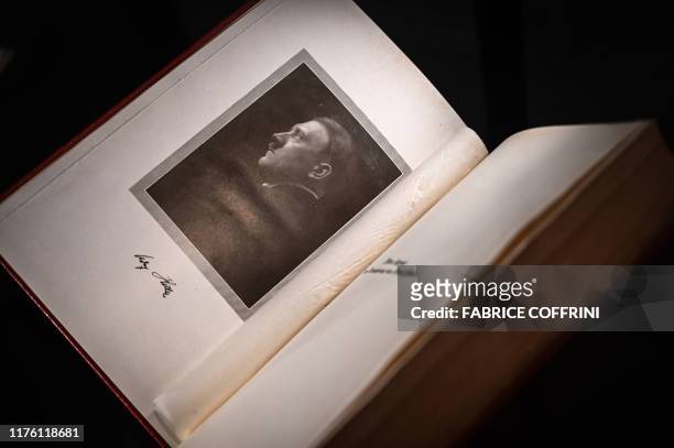 An autographed original edition of Adolf Hitler's "Mein Kampf" book is displayed at Martin Bodmer Foundation during the "War and Peace" exhibition on...