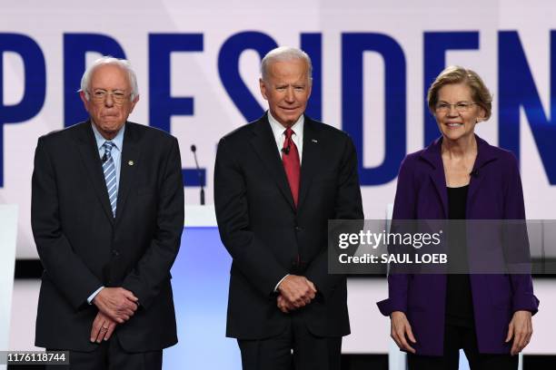 Democratic presidential hopefuls Vermont Senator Bernie Sanders, former US Vice President Joe Biden and Massachusetts Senator Elizabeth Warren arrive...