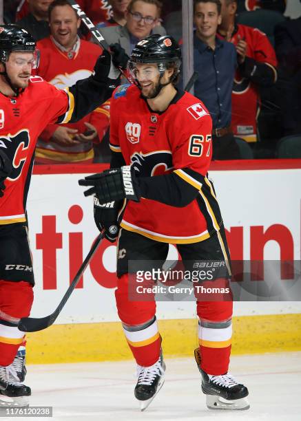 Michael Frolik of the Calgary Flames celebrates a goal against the Philadelphia Flyers during his 800th NHL game on October 15, 2019 at the...