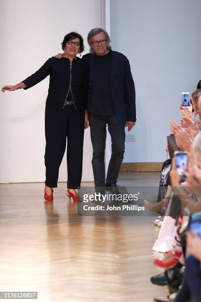 Fashion designers Piero Cividini and Miriam Cividini acknowledge the applause of the audience after the Cividini show during the Milan Fashion Week...