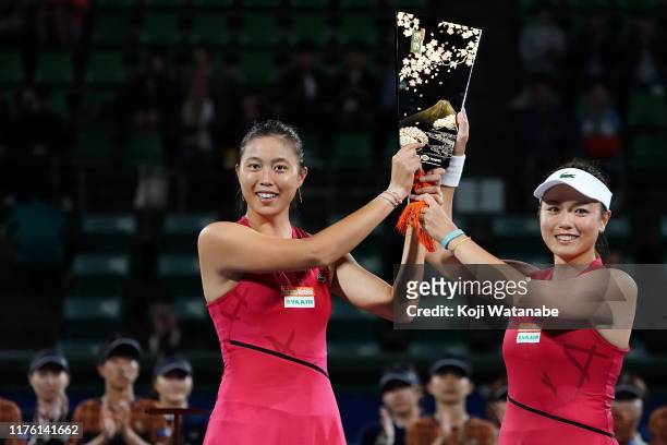 Doubles champion Hao-Ching Chan and Latisha Chan of Chinese Taipei pose for photographs after the Doubles final against Su-Wei Hisieh and Yu-Chieh...
