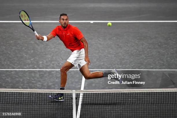 Nick Kyrgios of Team World plays a forehand in his singles match against Roger Federer of Team Europe during Day Two of the Laver Cup 2019 at Palexpo...