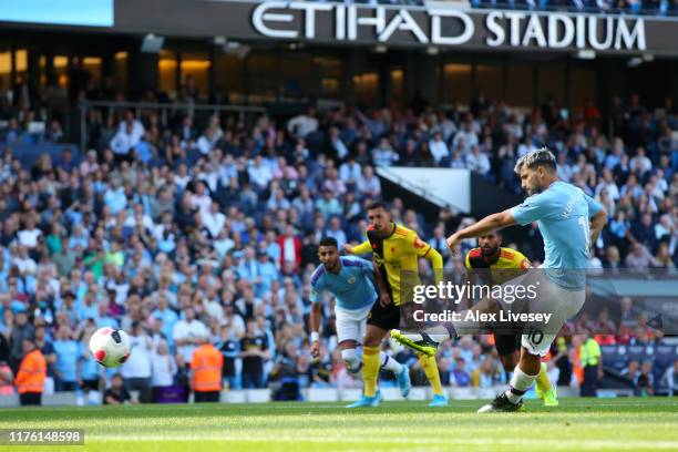 Sergio Aguero of Manchester City scores his teams second goal from the penalty spot during the Premier League match between Manchester City and...