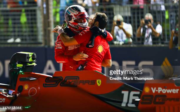 Pole position qualifier Charles Leclerc of Monaco and Ferrari celebrates in parc ferme during qualifying for the F1 Grand Prix of Singapore at Marina...