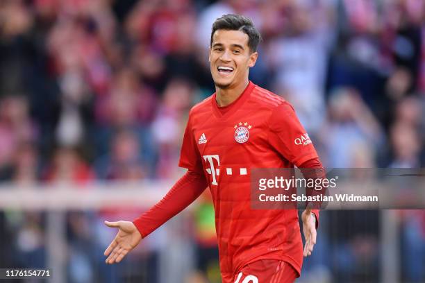 Philippe Coutinho of FC Bayern Munich celebrates as he scores his team's third goal from a penalty during the Bundesliga match between FC Bayern...