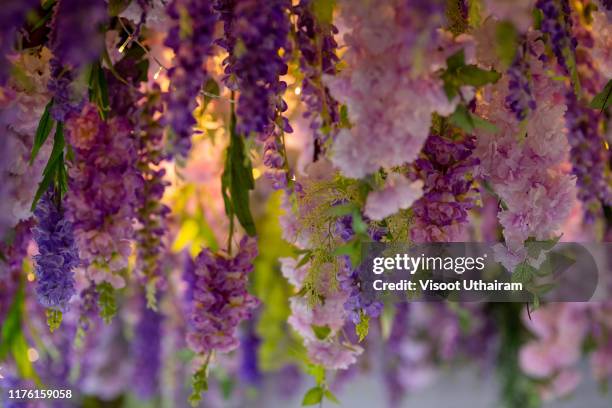 flowers is hanging on the ceiling. - hanging fabric from ceiling stock-fotos und bilder