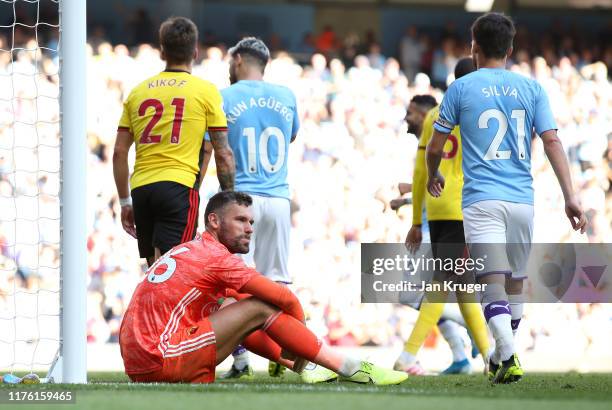Ben Foster of Watford sits on the ground dejected during the Premier League match between Manchester City and Watford FC at Etihad Stadium on...