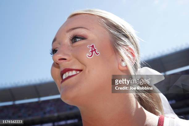 An Alabama Crimson Tide cheerleader looks on before the game against the Southern Mississippi Golden Eagles at Bryant-Denny Stadium on September 21,...