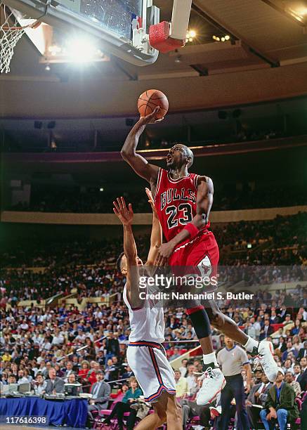 Michael Jordan of the Chicago Bulls shoots against John Starks of the New York Knicks circa 1989 at Madison Square Garden, in New York City. NOTE TO...