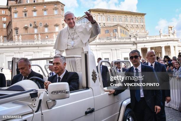 New Commander of the Vatican Gendarmerie, Gianluca Gauzzi Broccoletti escorts the Popemobile car Pope Francis leaves at the end of the weekly general...