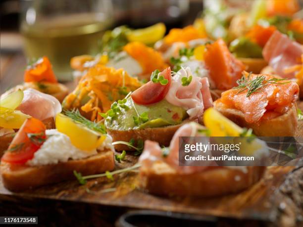platter of canape's - bruschetta stock pictures, royalty-free photos & images