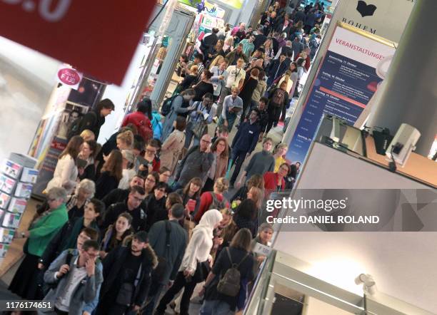 Visitors make their way around the Frankfurt book fair on the opening day in Frankfurt am Main, western Germany, on October 16, 2019. - The Frankfurt...