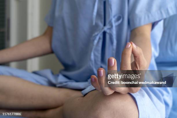 woman over isolated background relax . yoga concept. - nurse meditating stock pictures, royalty-free photos & images