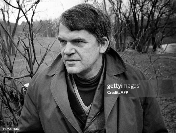 Czech writer Milan Kundera poses in a garden in Prague 14 October 1973. Novelist born in Brno, Czech Republic, Kundera lectured in Cinematographic...