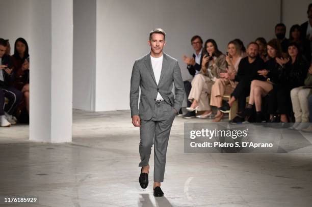 Fashion designer Simon Holloway acknowledges the applause of the audience at the Agnona show during the Milan Fashion Week Spring/Summer 2020 on...