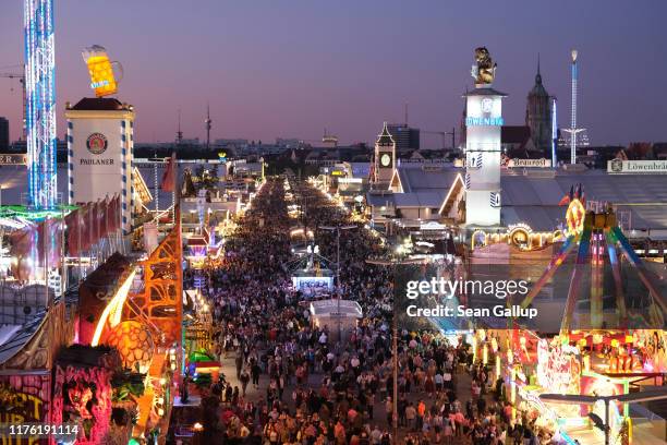 The main avenue lined with beer tents stands illuminated on the first day of the 2019 Oktoberfest on September 21, 2019 in Munich, Germany. This...