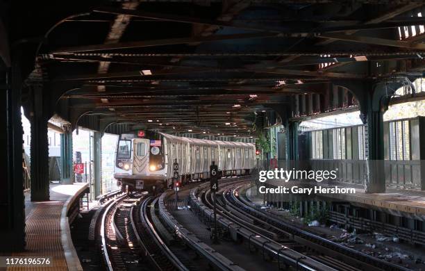 An F train pulls into the W. 8th Street subway station at Coney Island in Brooklyn on September 15 in New York City.