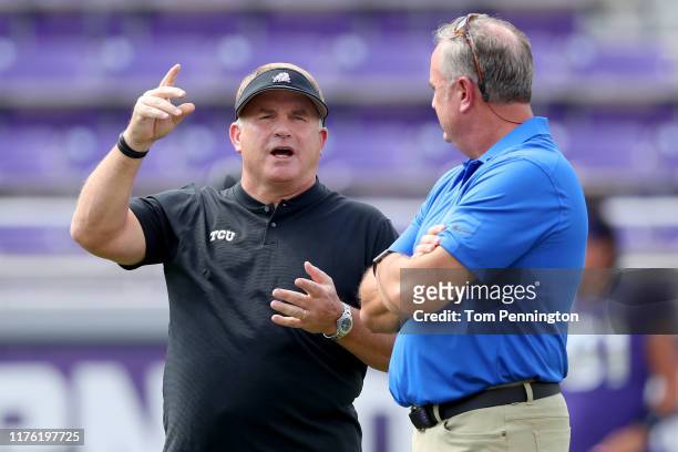 Head coach Gary Patterson of the TCU Horned Frogs talks with head coach Sonny Dykes of the Southern Methodist Mustangs before the Horned Frogs tak on...
