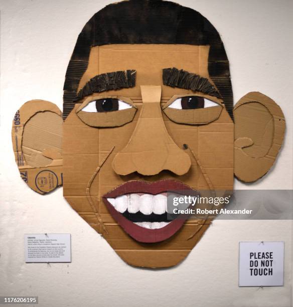 Cardboard portrait of former U.S. President Barack Obama is among artworks by children and high school students included in a display at the Country...