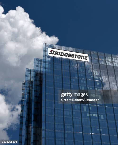 Cumulus clouds frame Bridgestone Tower in downtown Nashville, Tennessee. The skyscraper is headquarters for Bridgestone Americas, a subsidiary of...