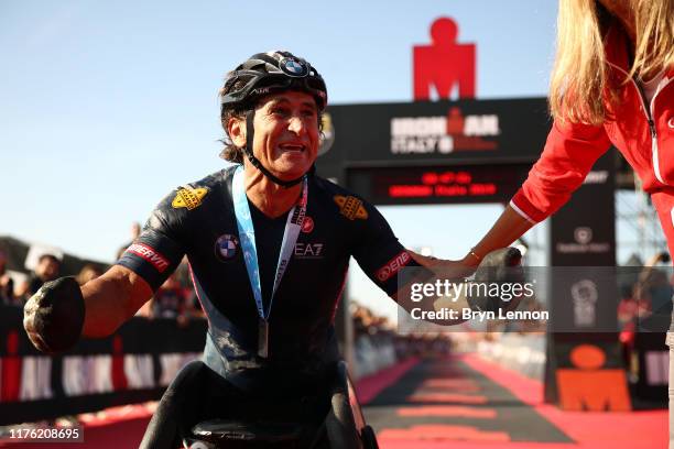 Alex Zanardi of Italy celebrates finishing IRONMAN Italy on September 21, 2019 in Cervia, Italy.