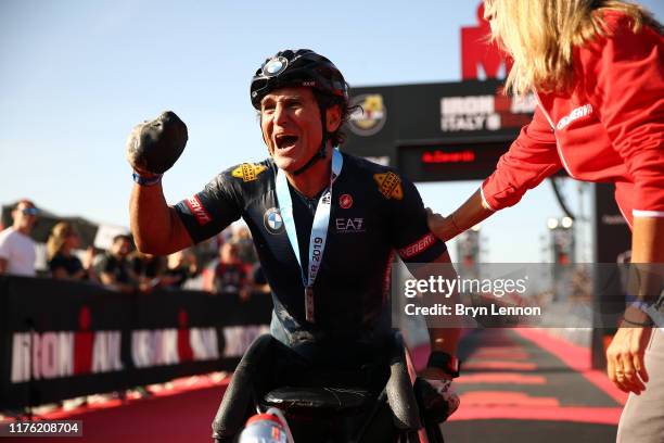 Alex Zanardi of Italy celebrates finishing IRONMAN Italy on September 21, 2019 in Cervia, Italy.