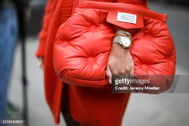 Aylin Koenig wearing a Maison Margiela bag and Rolex watch poses outside the Max Mara show during Milan Fashion Week Spring/Summer 2020 on September...