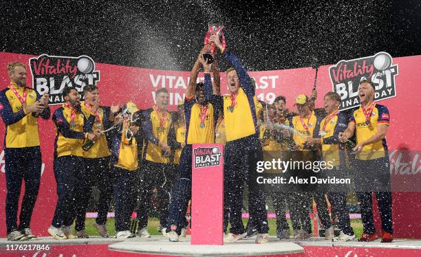 Ravi Bopara and Simon Harmer lift the Vitality Blast Trophy with their Essex teammates during the Vitality T20 Blast Final match between...