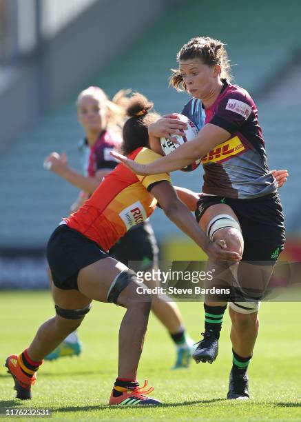 Abbie Scott of Harlequins Women is tackled by Grace Moore of Richmond Women during the Tyrells Premier 15s match between Harlequins Women and...