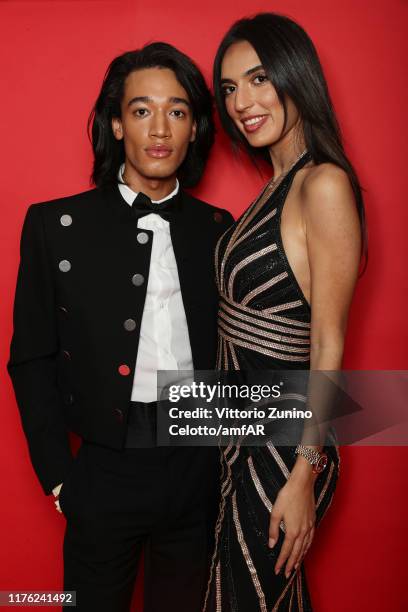 Noel Dulaku and guest attend the amfAR Gala Milano 2019 at Palazzo Mezzanotte on September 21, 2019 in Milan, Italy.