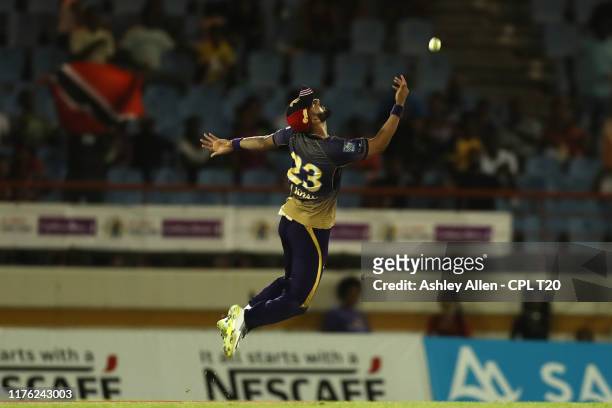 In this handout image provided by CPL T20, Ali Khan of Trinbago Knight Riders celebrates catching Rakeem Cornwall of the St Lucia Zouks during the...