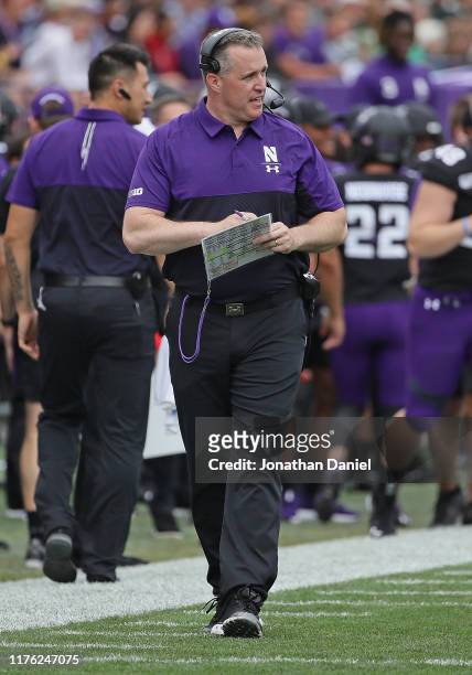 Head coach Pat Fitzgerald of the Northwestern Wildcats watches as his team takes on the Michigan State Spartans at Ryan Field on September 21, 2019...