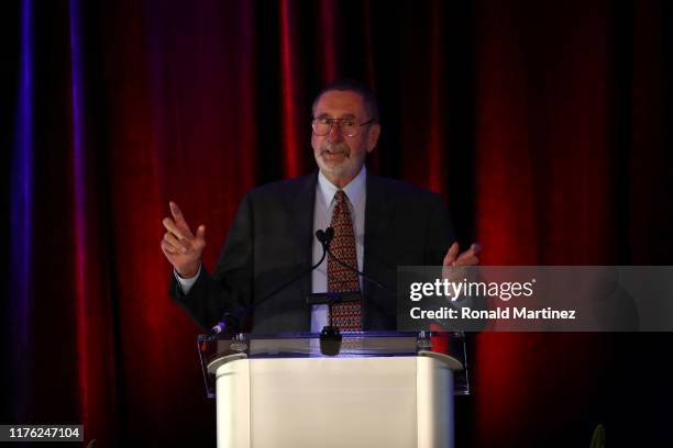 Photographer Tony Quinn speaks after accepting the 2019 Colin Jose Media Award during the 2019 National Soccer Hall Of Fame Induction Ceremony at...